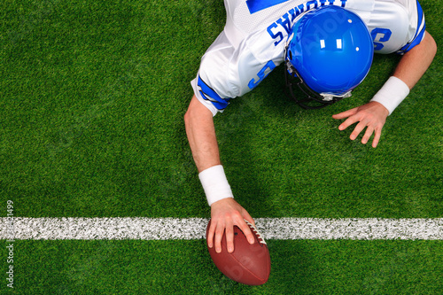 Overhead American football player one handed touchdown photo