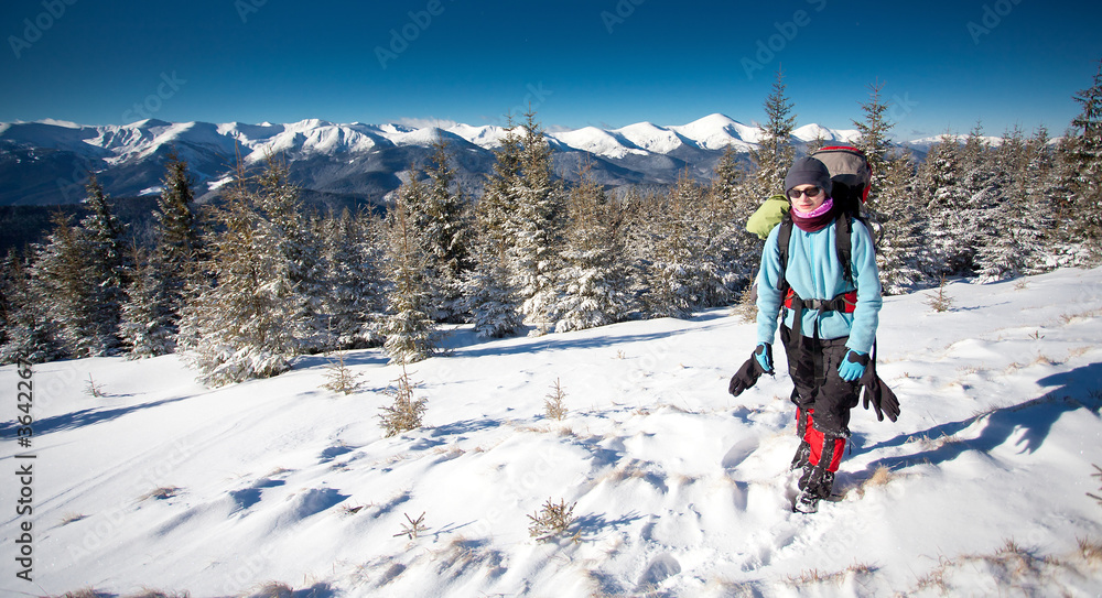 Hiker in winter mountains