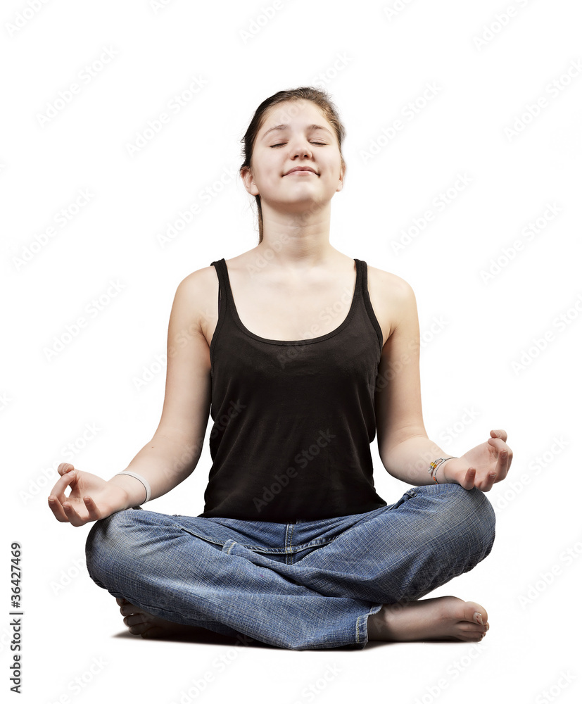 young woman practicing yoga in the lotus position, isolated on w