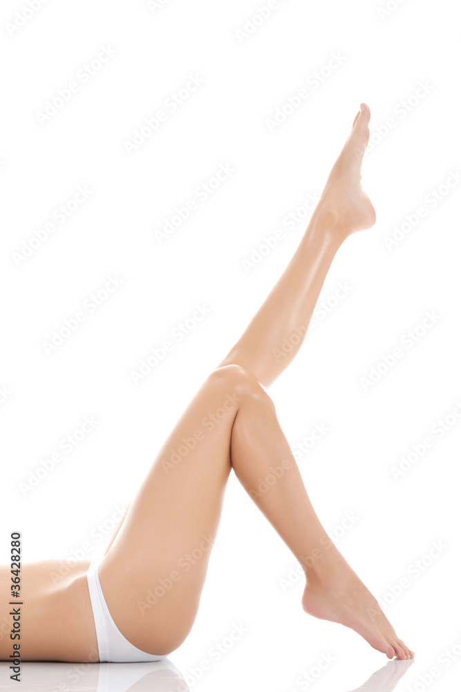 beautiful female legs barefoot lying on white background beautiful female legs barefoot lying on white background