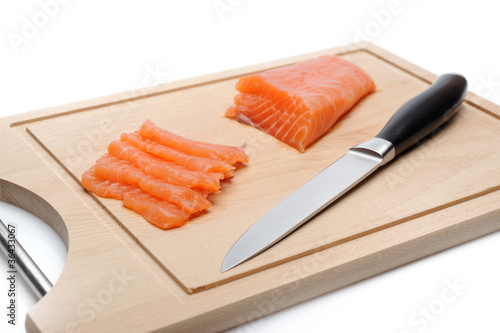 fresh raw salmon fish on wooden board isolated. sushi ingredient