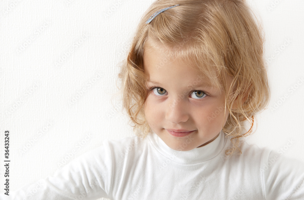 Blonde little girl dressed in white Blonde little girl dressed in white