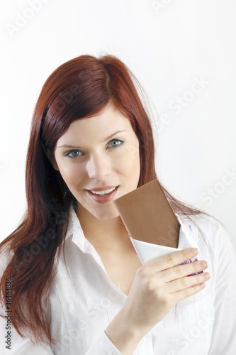 beautiful young woman with a block of chocolate