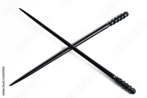 Two Black chopsticks isolated on white ornate decorations