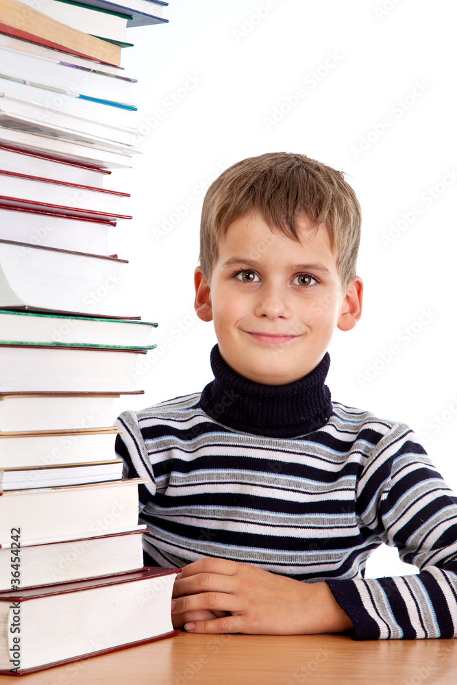 Schoolboy and a heap of books isolated on a white background Schoolboy and a heap of books isolated on a white background