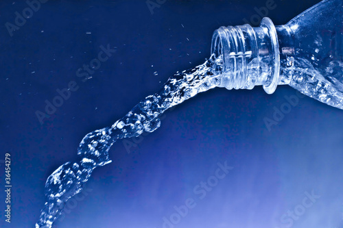 spray and drops of water from plastic bottles