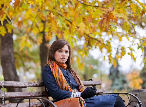 Young woman sitting on the bench