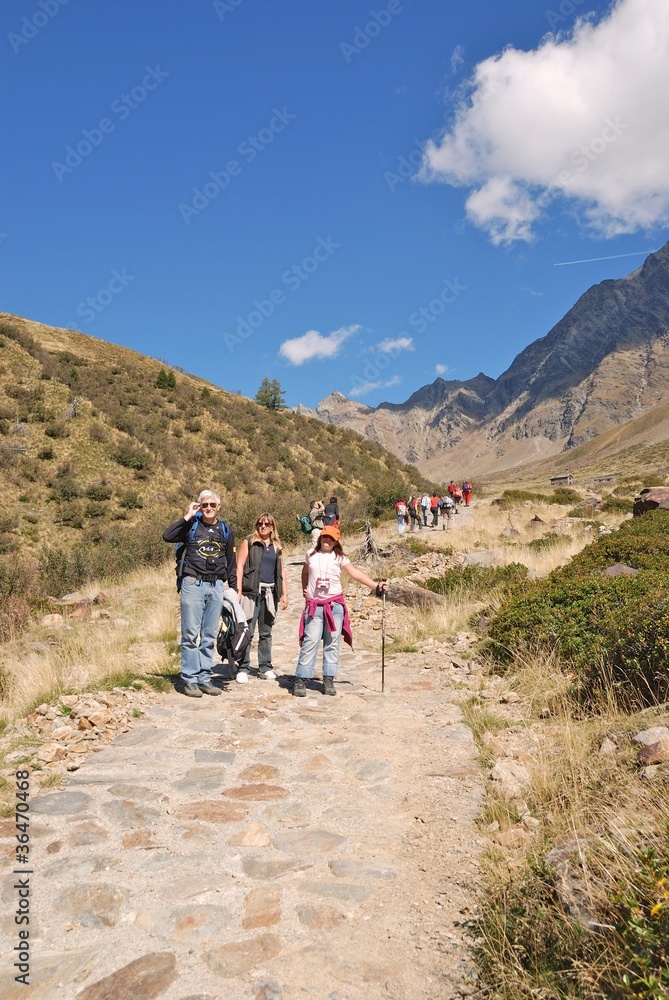 Group of people walking in the nature