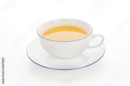 Teacup with green tea isolated.