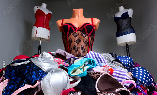 Mannequins in sexy lingerie, pile of bra
