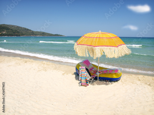 Sunchairs and umbrella on Carribean Beach