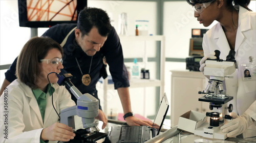 Detective Going Over Crime Evidence in Lab