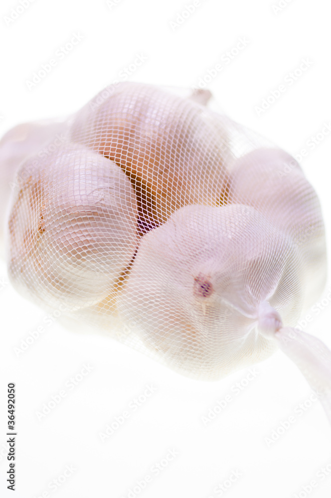 Bulbs of garlic in a bag close up Bulbs of garlic in a bag close up