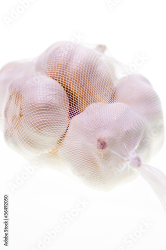 Bulbs of garlic in a bag close up