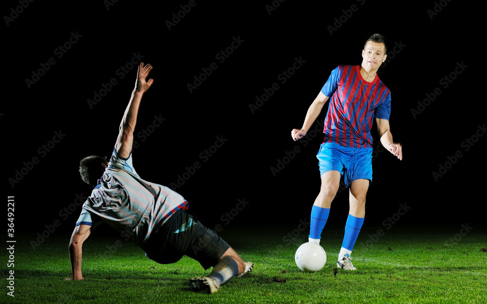 football players in competition for the ball