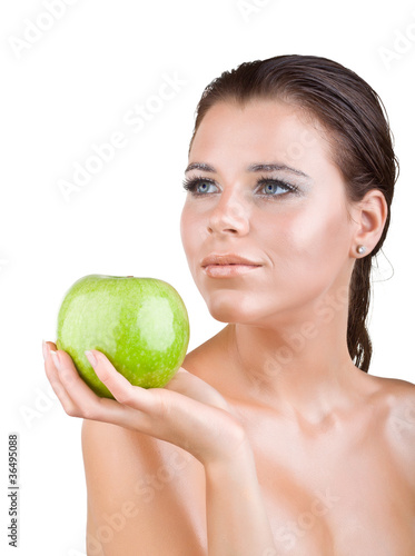 Beautiful girl holds in a hand green apple