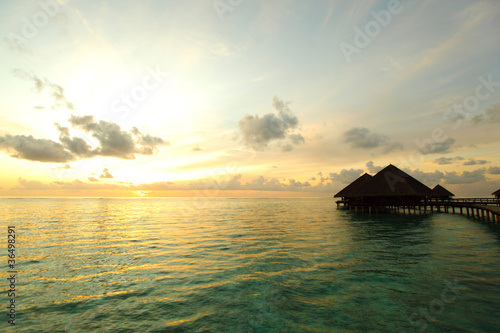 maldivian houses on sunrise © yellowj