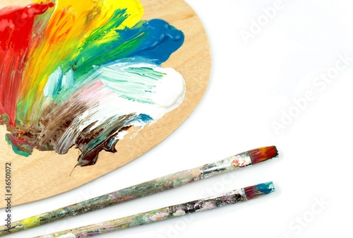 Paintbrushes and colors  on palet photo