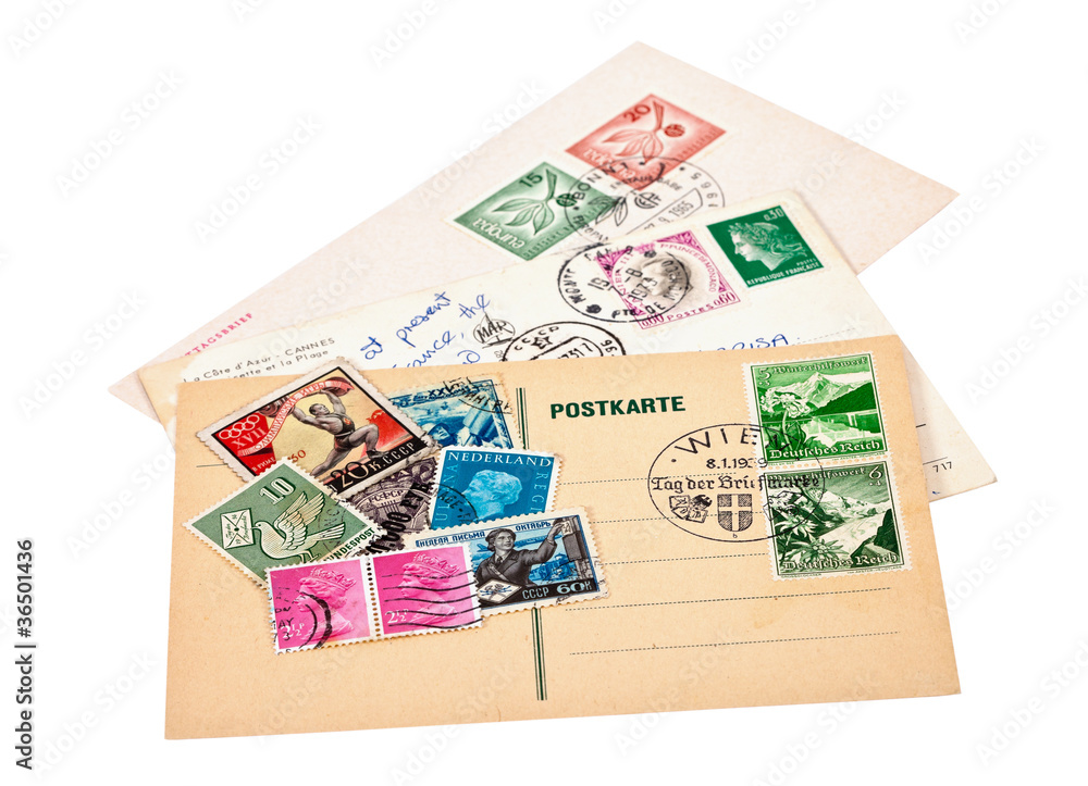 Postage stamps and postage cards on white background