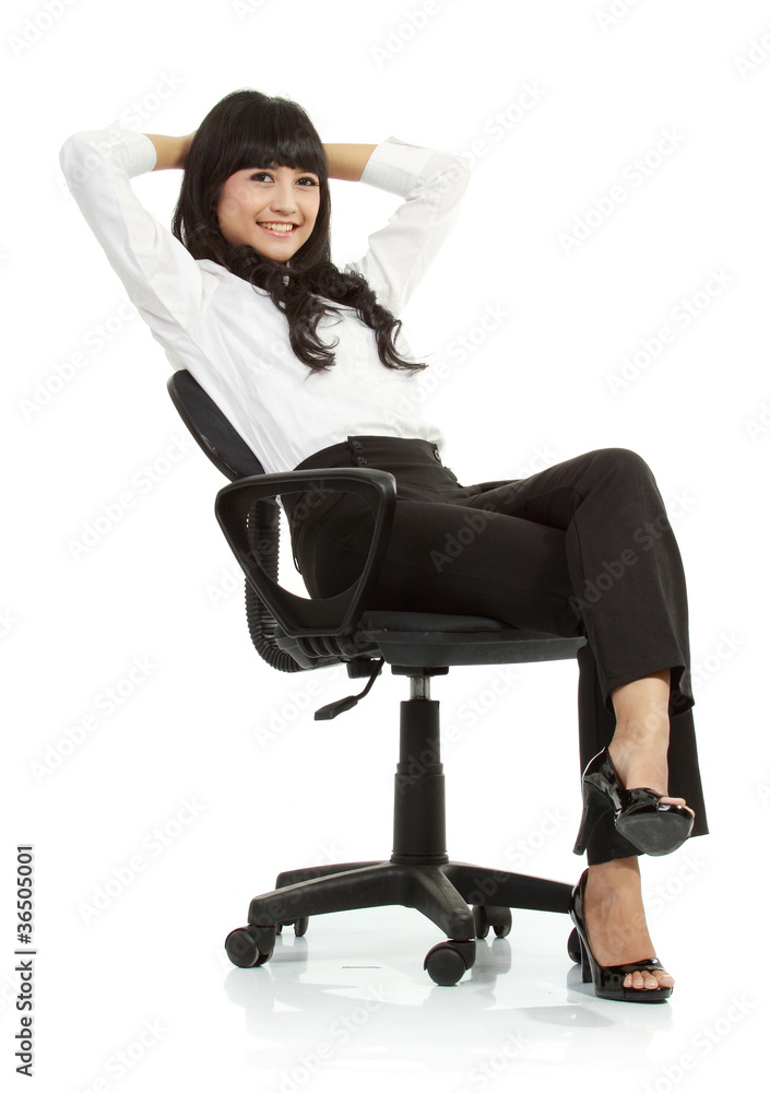Fototapeta premium gorgeous young woman sitting on a chair