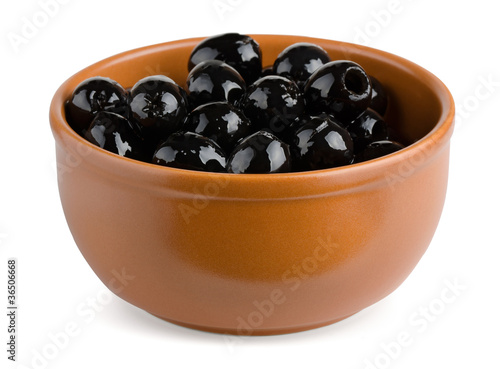 Terracotta bowl of black pitted olives