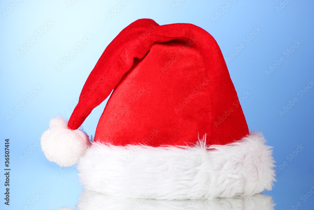Beautiful Christmas hat on a blue background Beautiful Christmas hat on a blue background