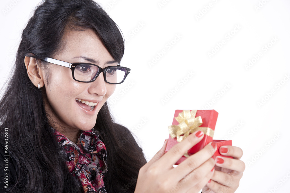 Businesswoman surprised getting a present Businesswoman surprised getting a present