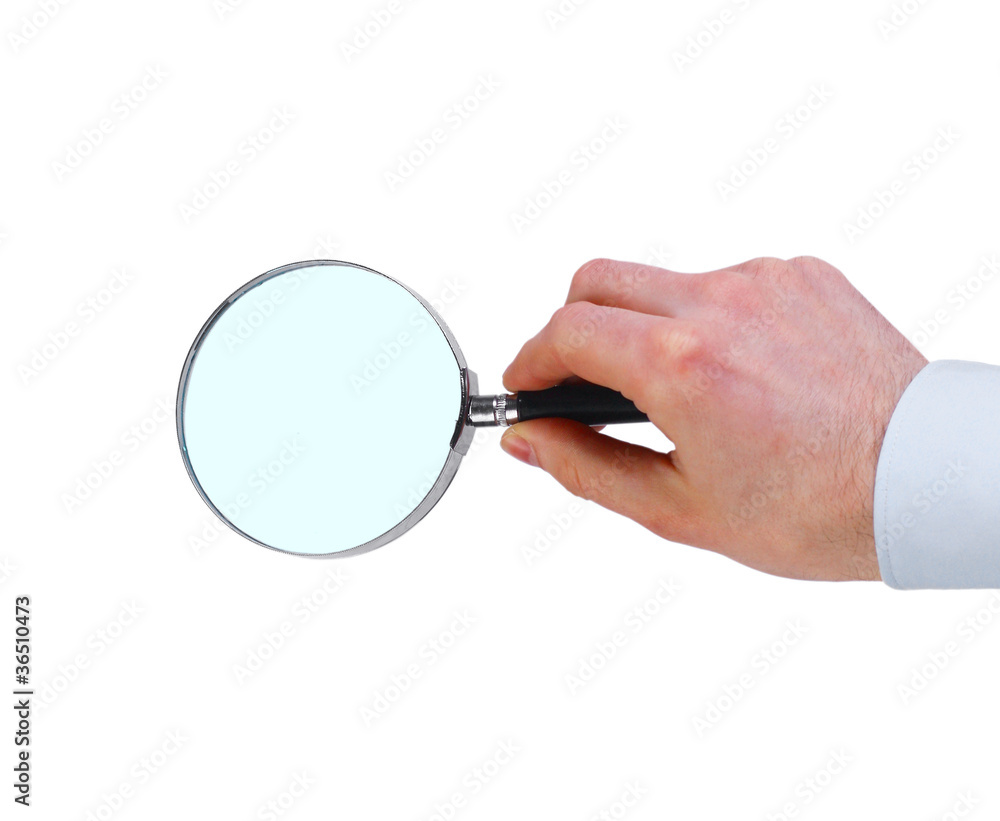 Magnifying glass in hand isolated on white background Magnifying glass in hand isolated on white background