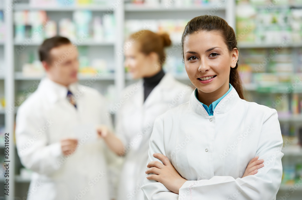 Pharmacy chemist woman in drugstore - obrazy, fototapety, plakaty 