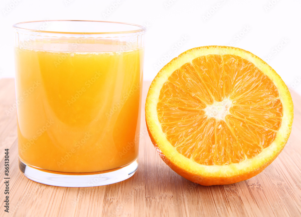 Glass of Orange juice and a half of an orange Glass of Orange juice and a half of an orange