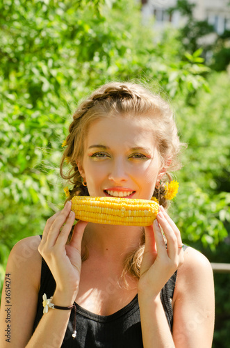 woman eating corn-cob