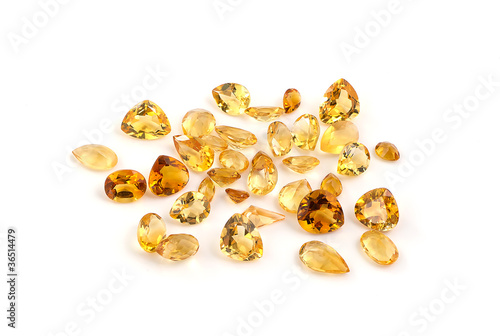 Group of citrine gemstones on white.