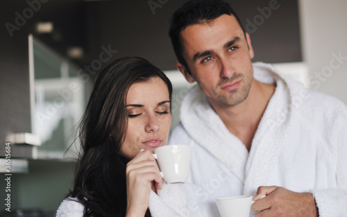 Young love couple taking fresh morning cup of coffee