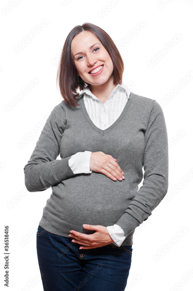 happy pregnant woman in grey pullover