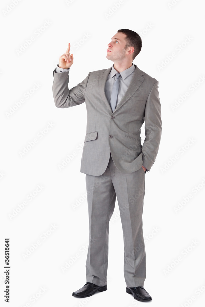 Portrait of a businessman pointing at a blank space Portrait of a businessman pointing at a blank space
