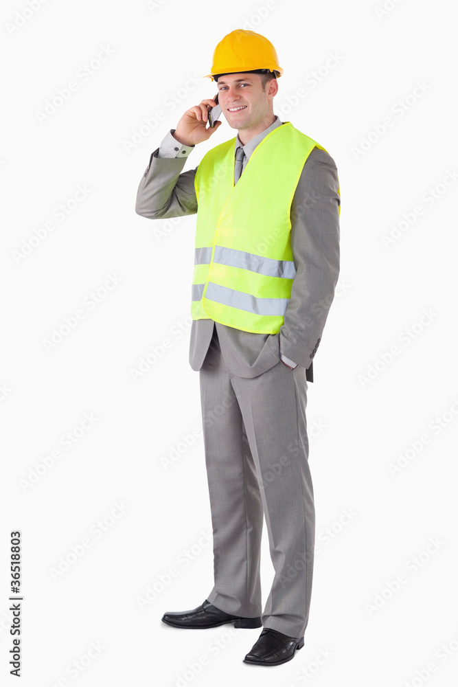 Portrait of a smiling builder making a phone call Portrait of a smiling builder making a phone call