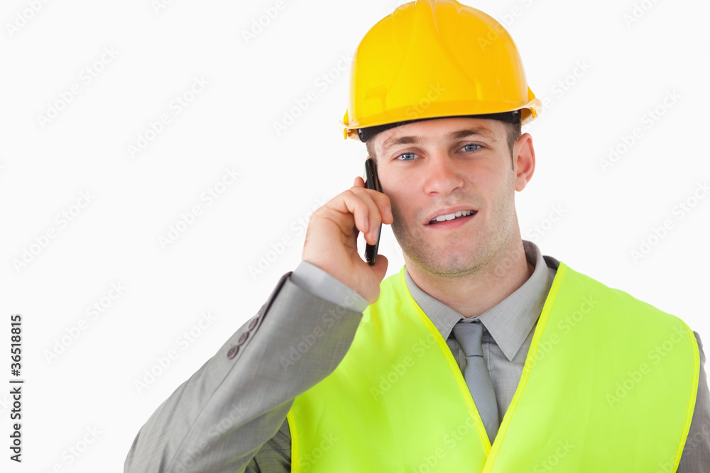 Builder using his cellphone Builder using his cellphone