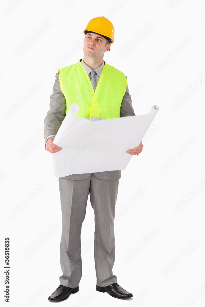 Portrait of a thoughtful architect holding a plan Portrait of a thoughtful architect holding a plan