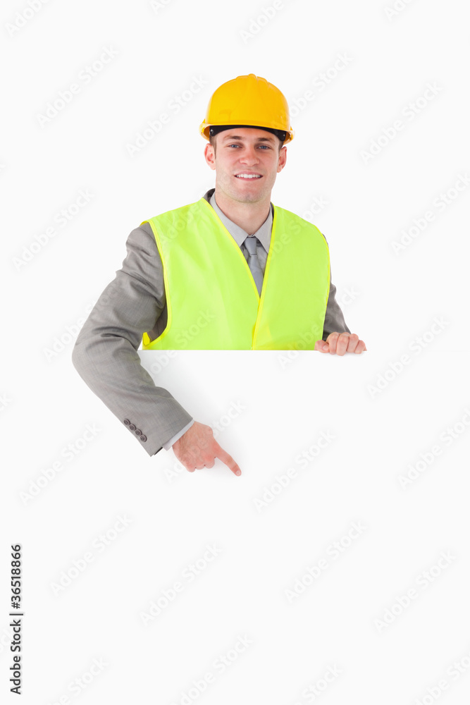 Portrait of a builder pointing at something Portrait of a builder pointing at something