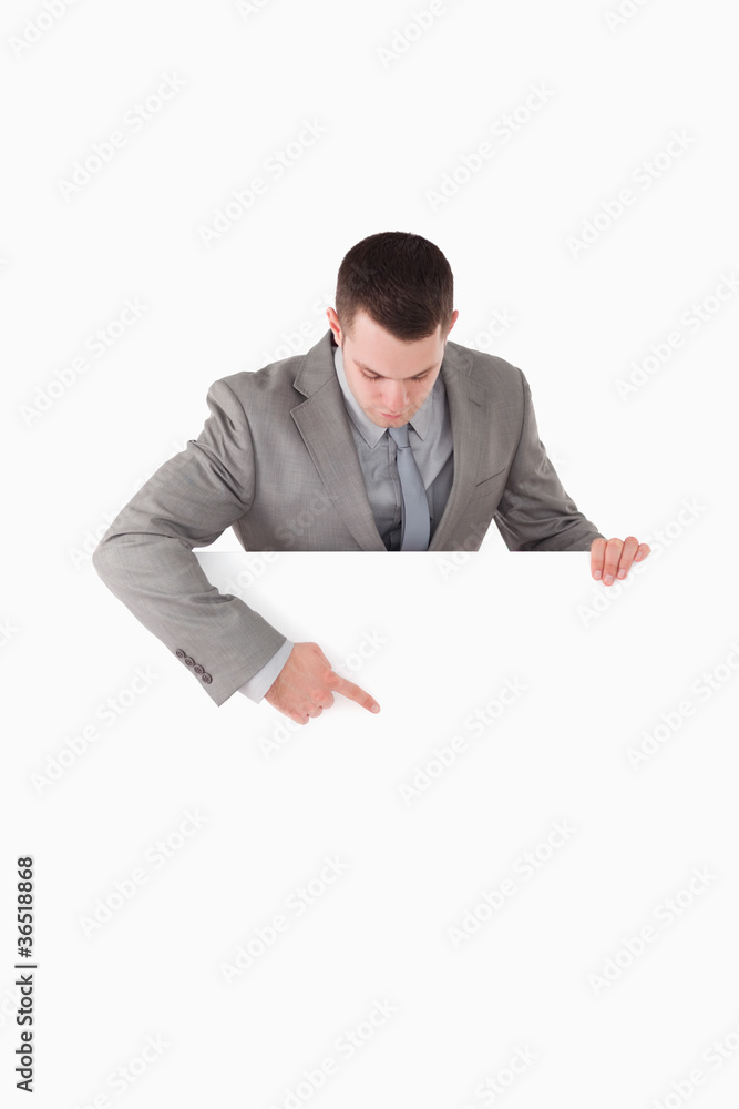 Portrait of a businessman pointing at something on a panel Portrait of a businessman pointing at something on a panel