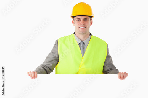 Builder holding a blank panel