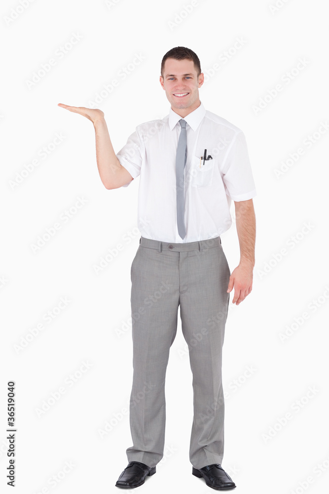 Portrait of a smiling office worker holding something Portrait of a smiling office worker holding something