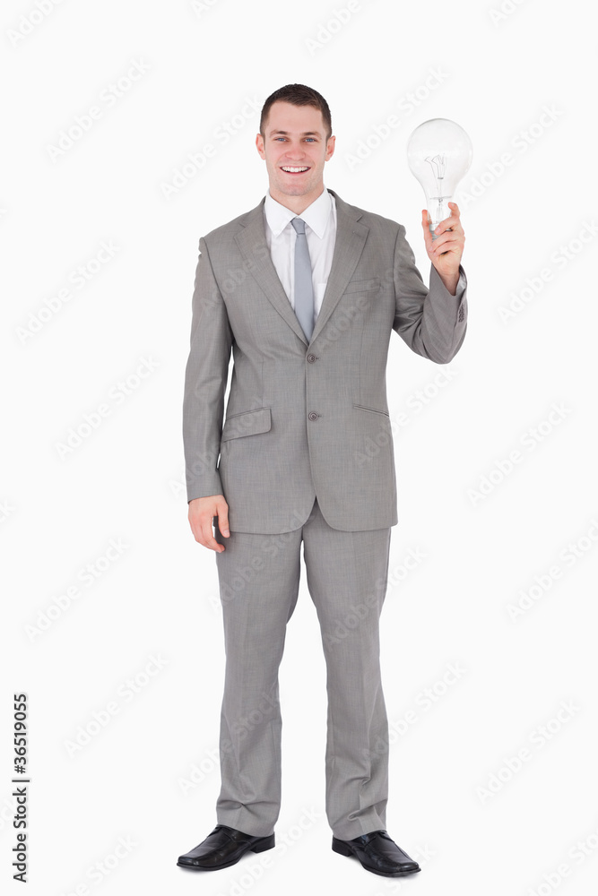 Portrait of a businessman holding a bulb Portrait of a businessman holding a bulb