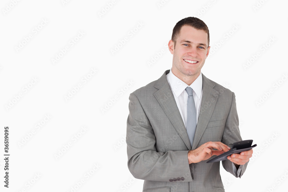 Businessman working with a calculator