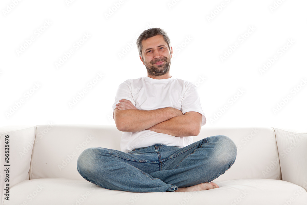 Casual man sitting on sofa Casual man sitting on sofa