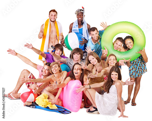 Group people holding beach accessories.