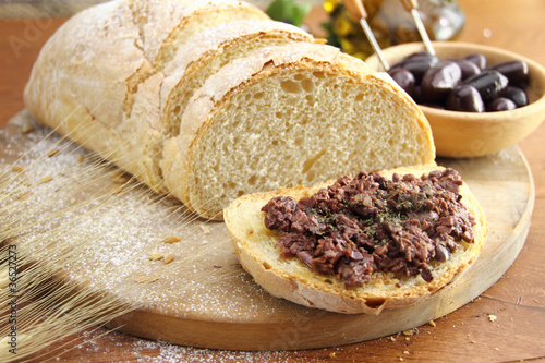 Fresh bread with olive tapenade photo