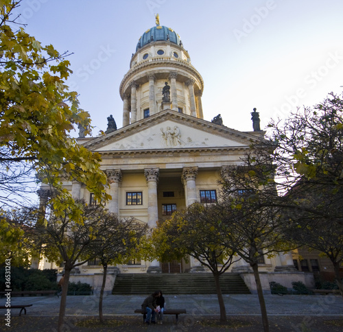 Couple kissing with French Cathedral on the background photo