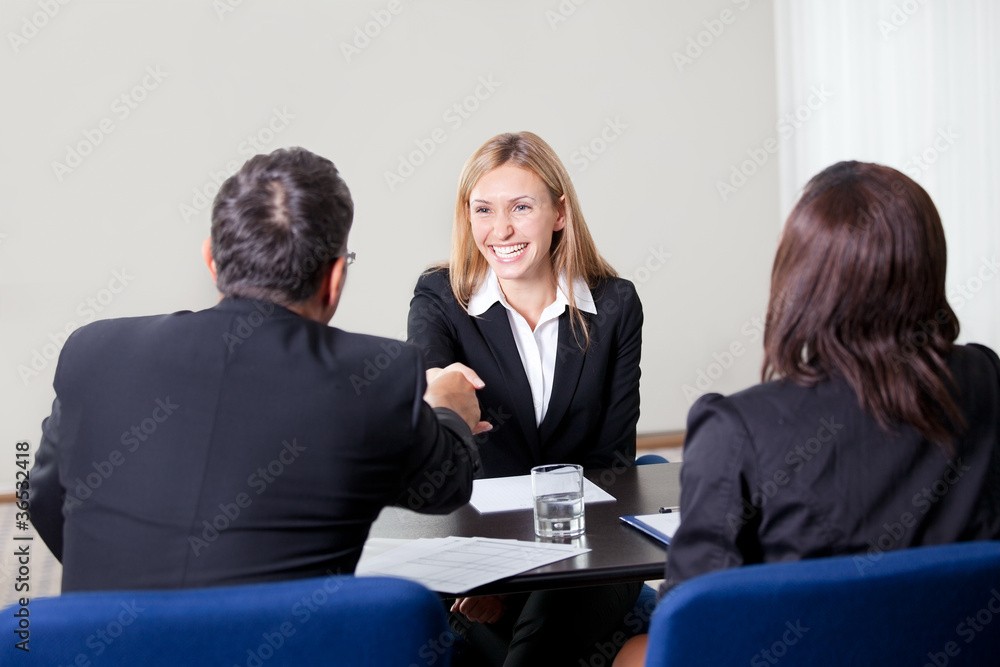 Female shaking hands at the job interview Female shaking hands at the job interview