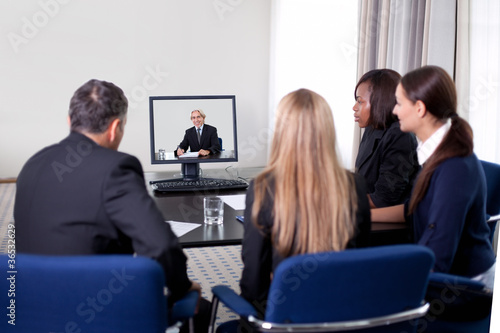 Businesspeople at a video conference © Andrey Popov